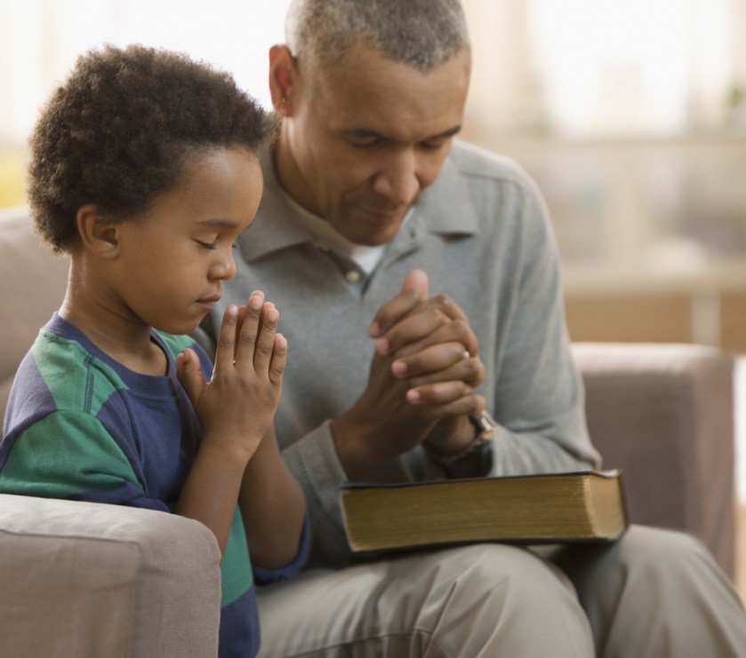 dad-and-son-pray-slide_405696_5101570_free