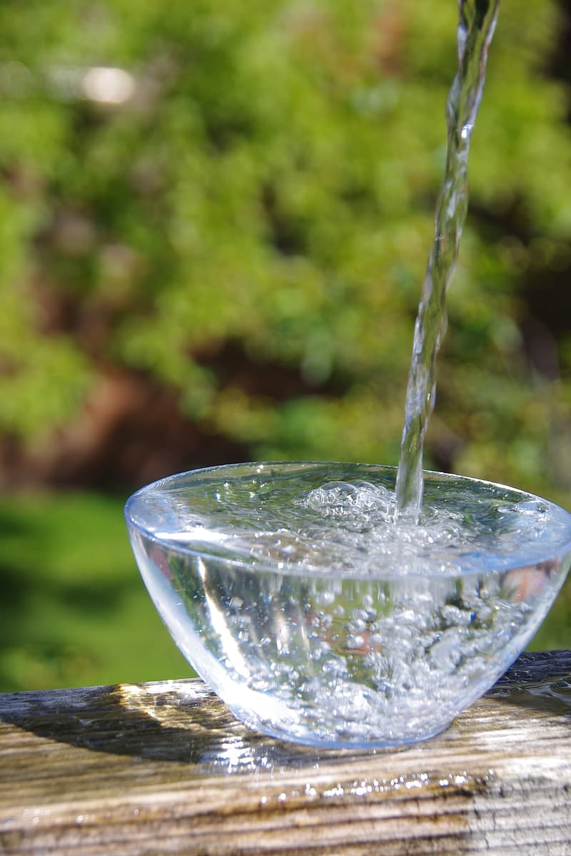 pouring-water-on-glass-bowl
